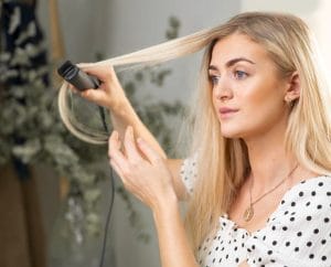 Hair-Straightener-Mistakes-6-You’re-Pulling-Your-Hair-Down